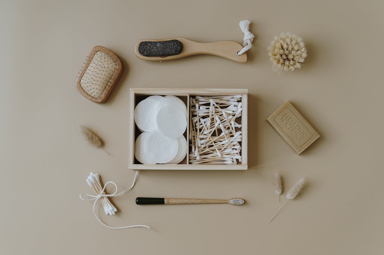 Flat lay of eco-friendly bath products including brushes and cotton buds for sustainable living.
