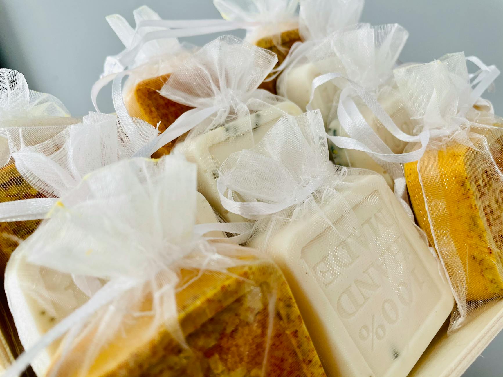 Artisan soaps in sheer bags, perfect for gifts. Highlighting natural, organic skincare beauty.